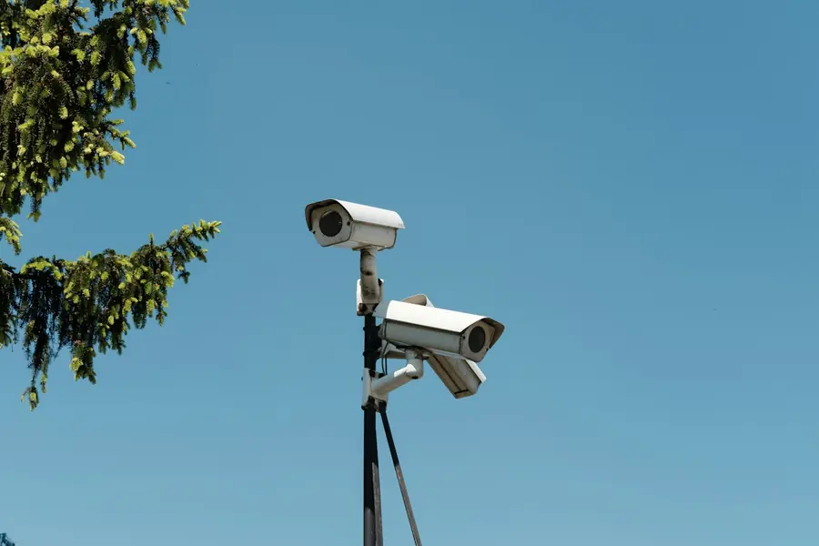 Two CCTV security cameras mounted on a pole